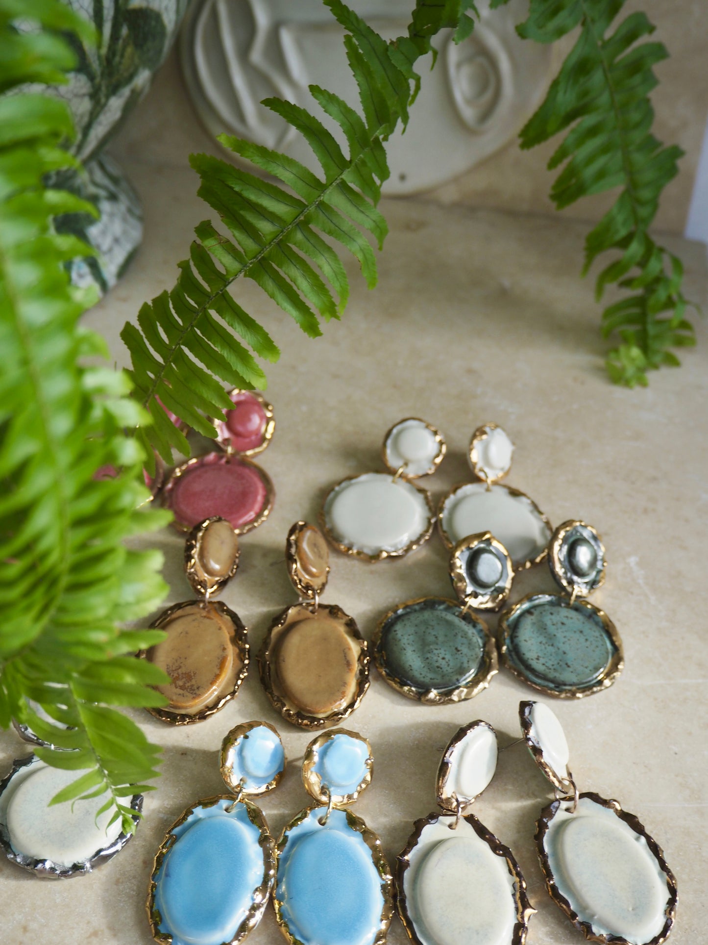 Femminilità Porcelain Earrings in a “green speckled ash” coloured glaze with 24k Gold lustre textured rims