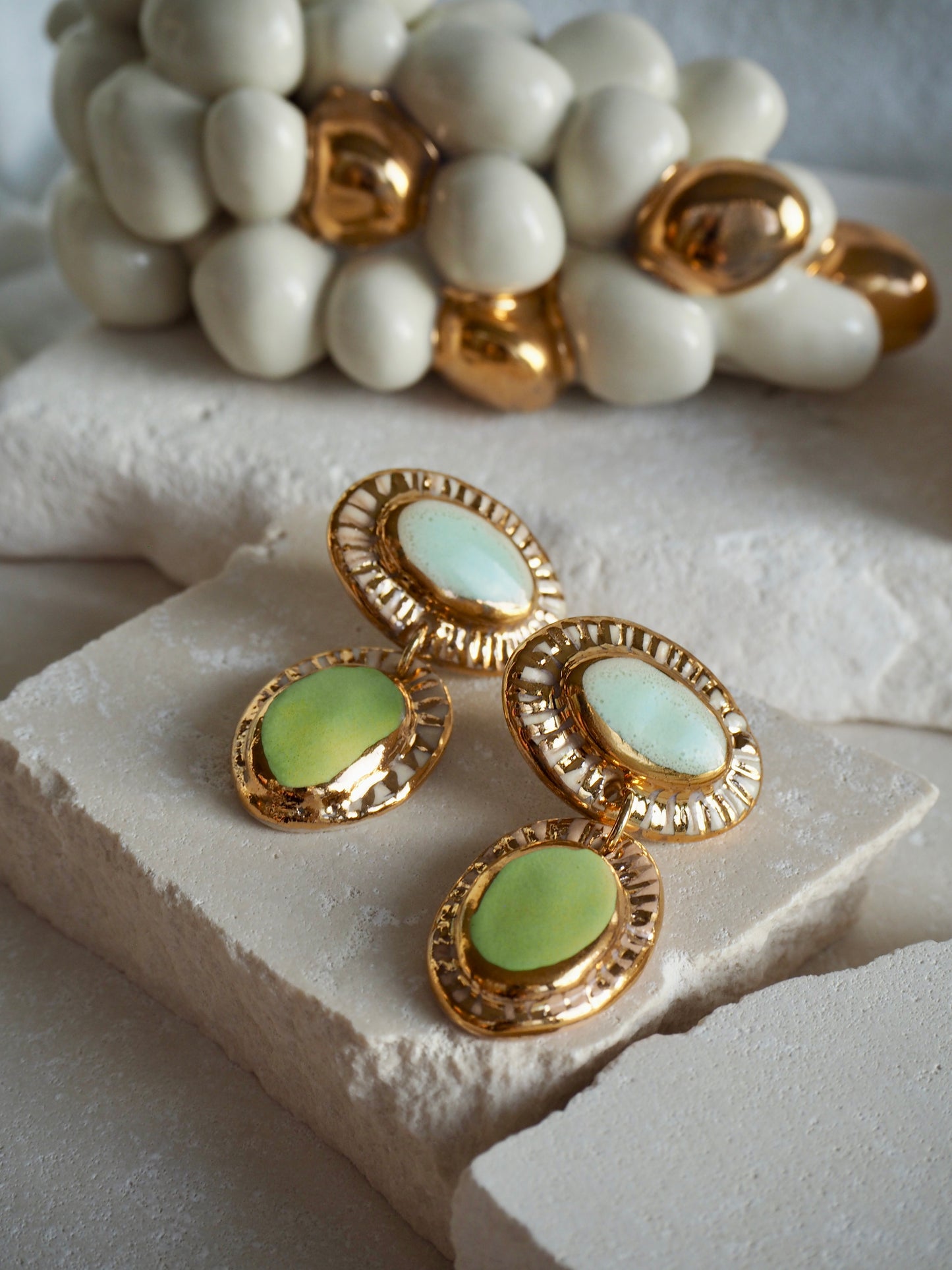 Hideaway Bay “Anima” Handmade Porcelain Earrings with Parchment underglaze and Green & Pale blue glazes with 24k gold lustre rays