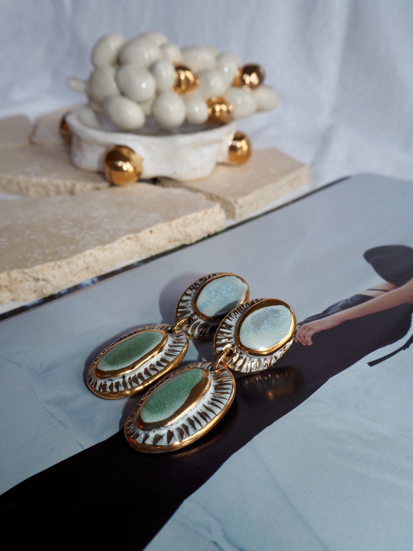 Pietra Collection handmade Black Clay Earrings coloured using light blue and green glaze with 24k gold lustre details