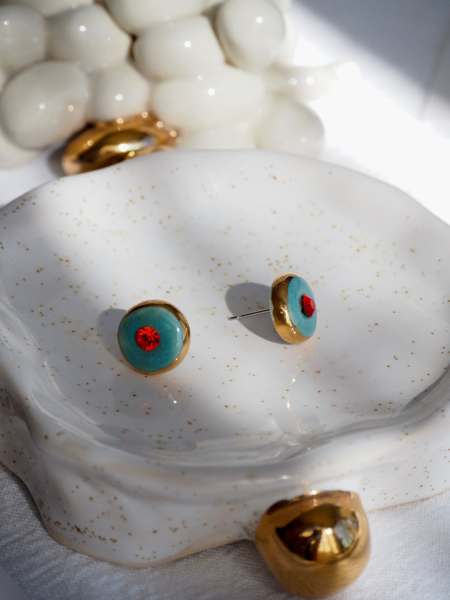 “Supernova” Aqua Green Small Handmade Porcelain Studs with 24k Gold lustre rims and Swarovskis Crystal.