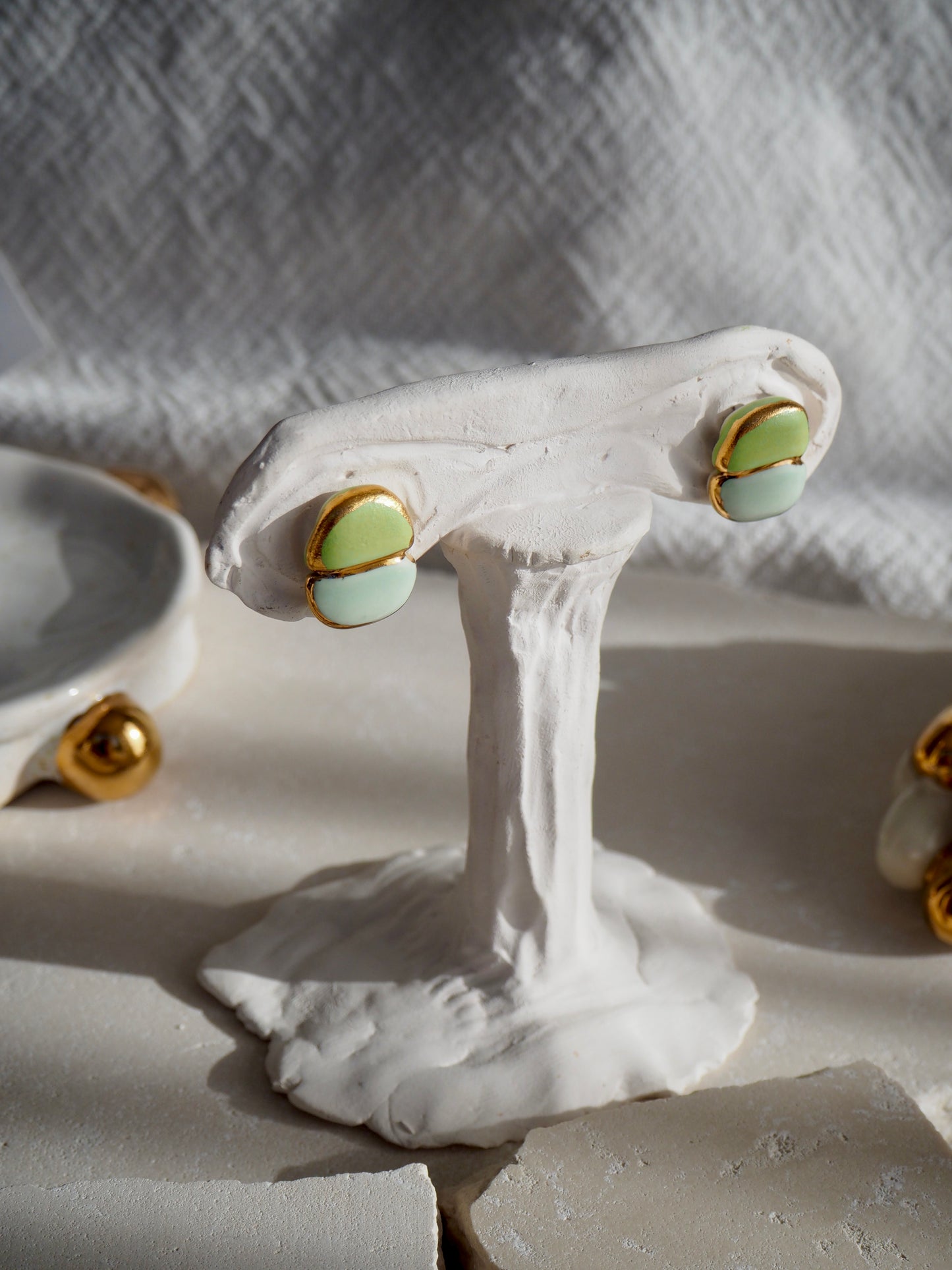 “il Quadrato Coccinella” Small Handmade Porcelain Studs coloured with Light Green&Blue matt glossy glazes with 24k Gold lustre details