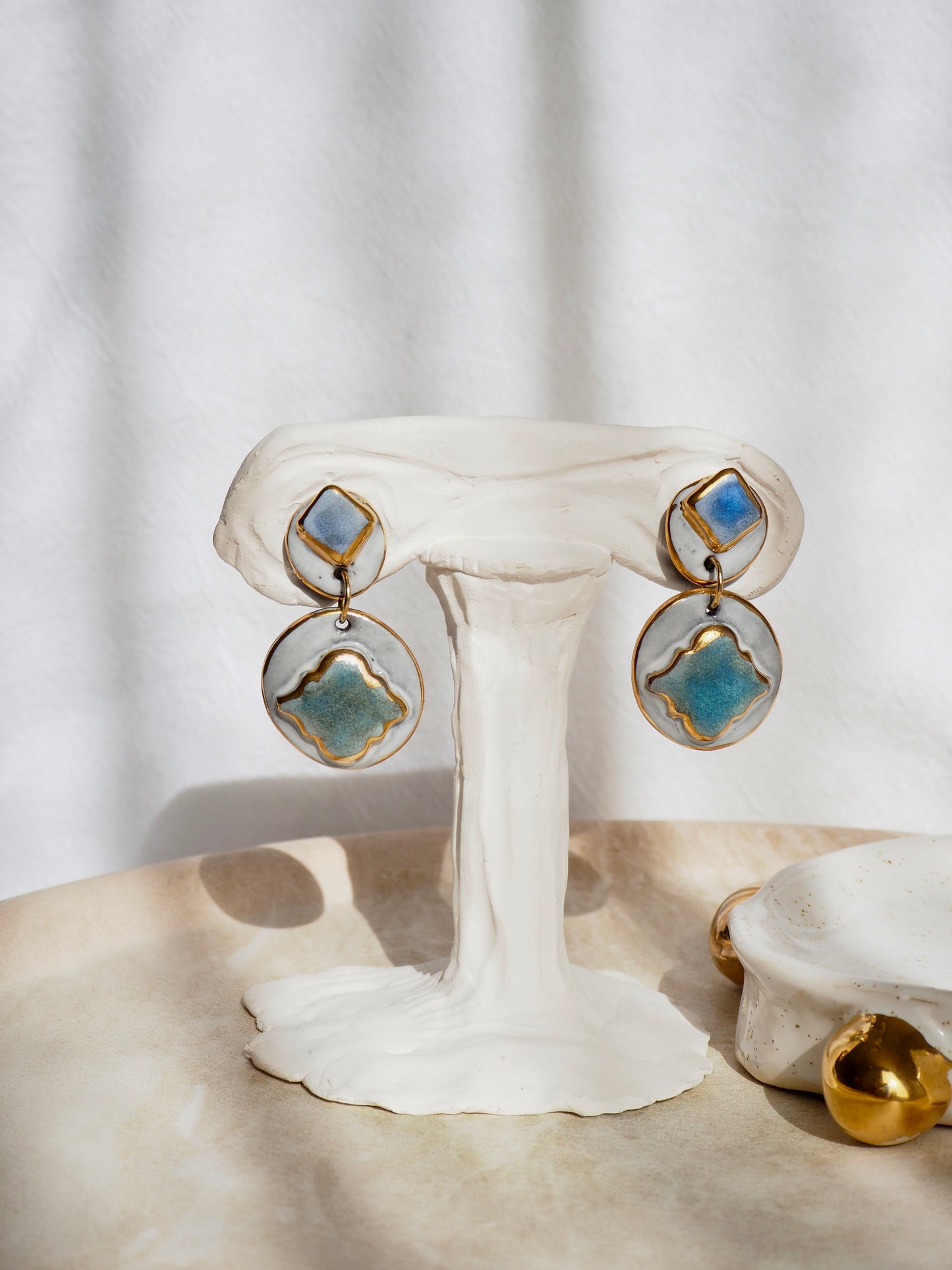 Pietra Collection handmade Black Clay Earrings coloured using green and blue glazes with 24k gold lustre details