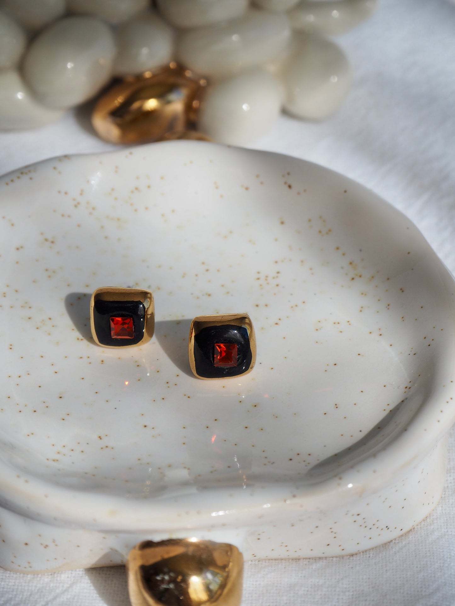 “Supernova” Black Small Square Handmade Porcelain Studs with 24k Gold lustre rims and an Swarovskis Crystal