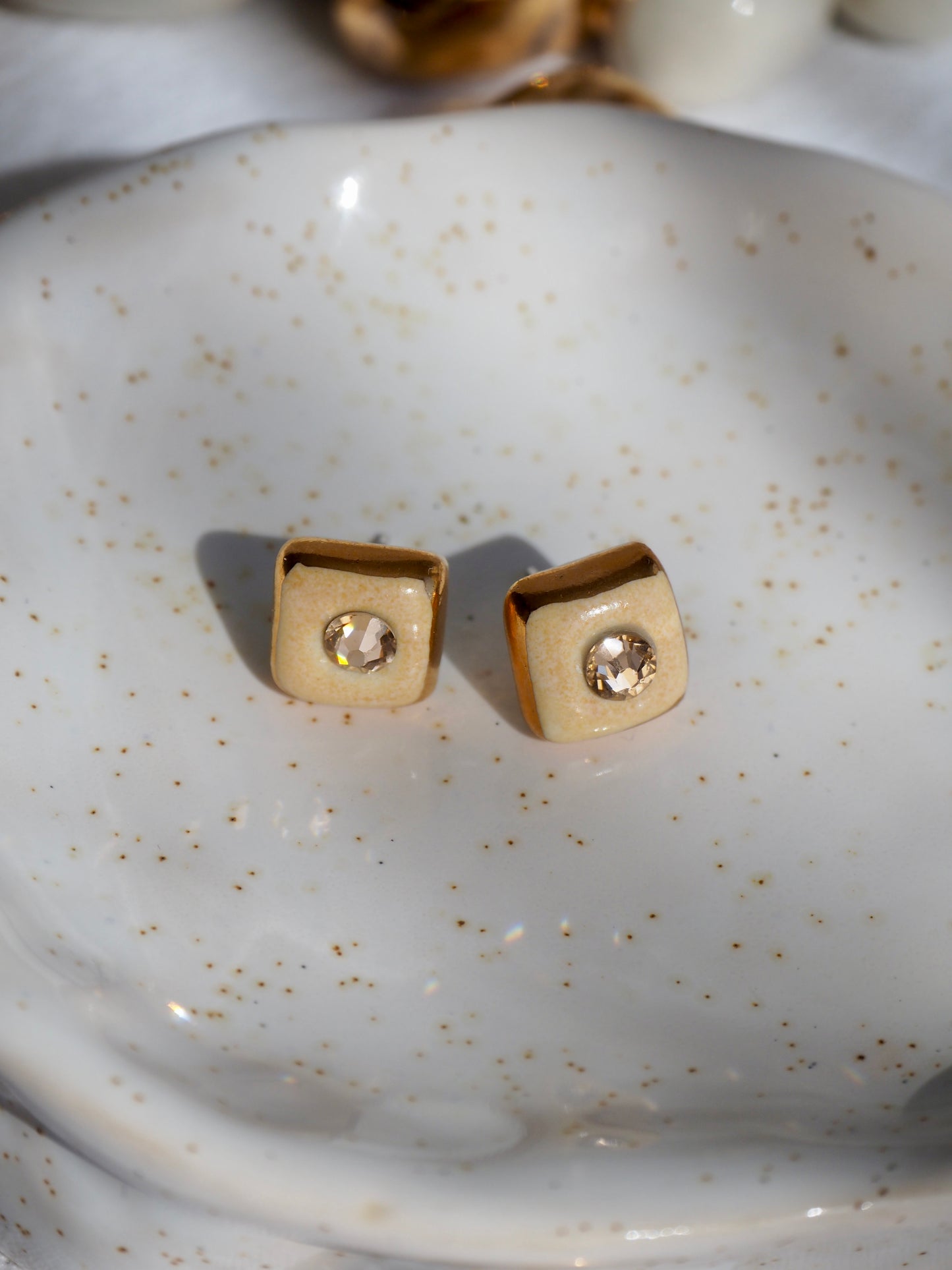 “Supernova” Pale Orange Small Square Handmade Porcelain Studs with 24k Gold lustre rims and Swarovskis Cristals.