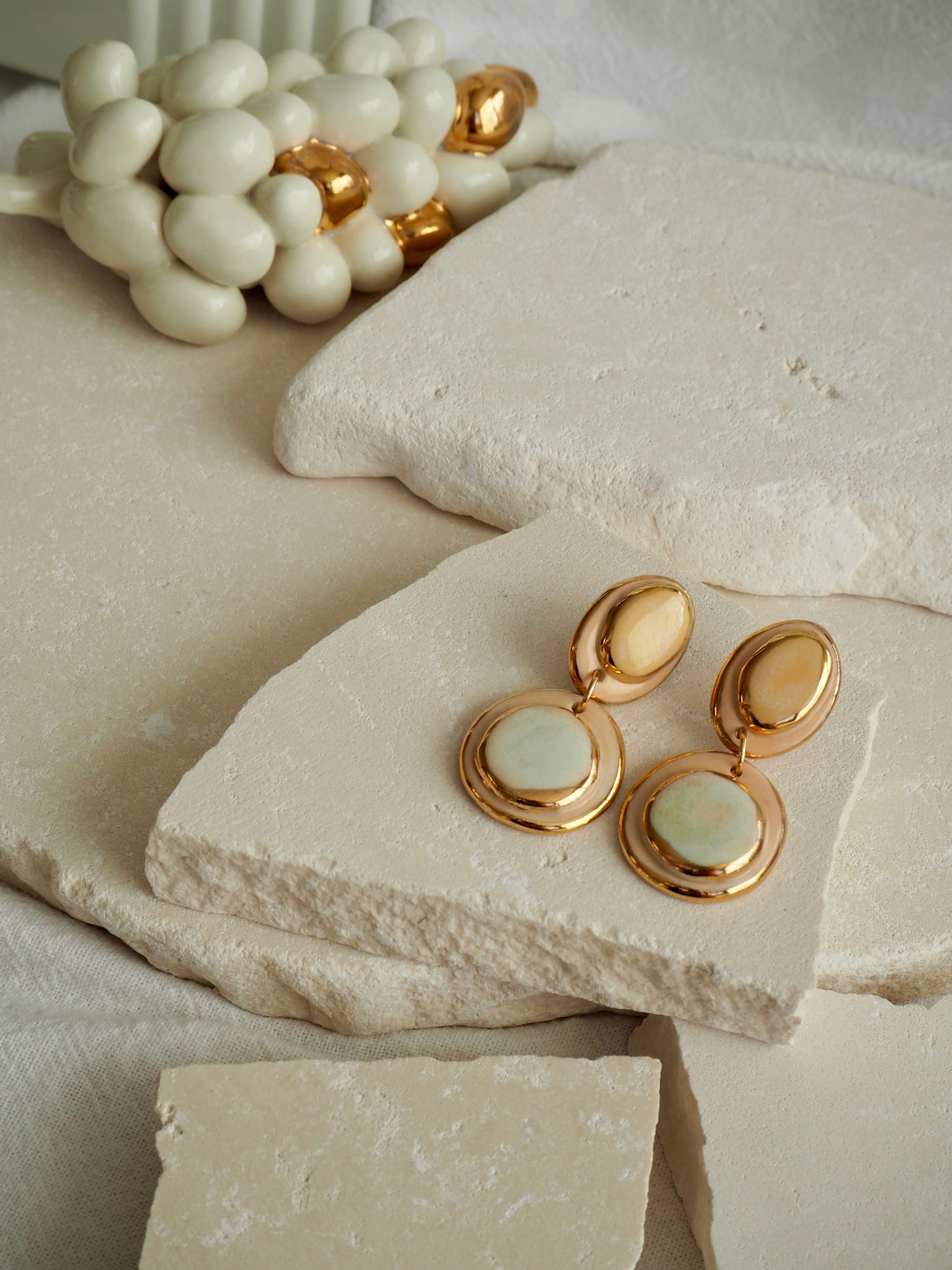 Femminilità Porcelain Earrings in Pale Lime and Mint Green coloured glossy glaze on Parchment underglaze with 24k Gold lustre textured rims