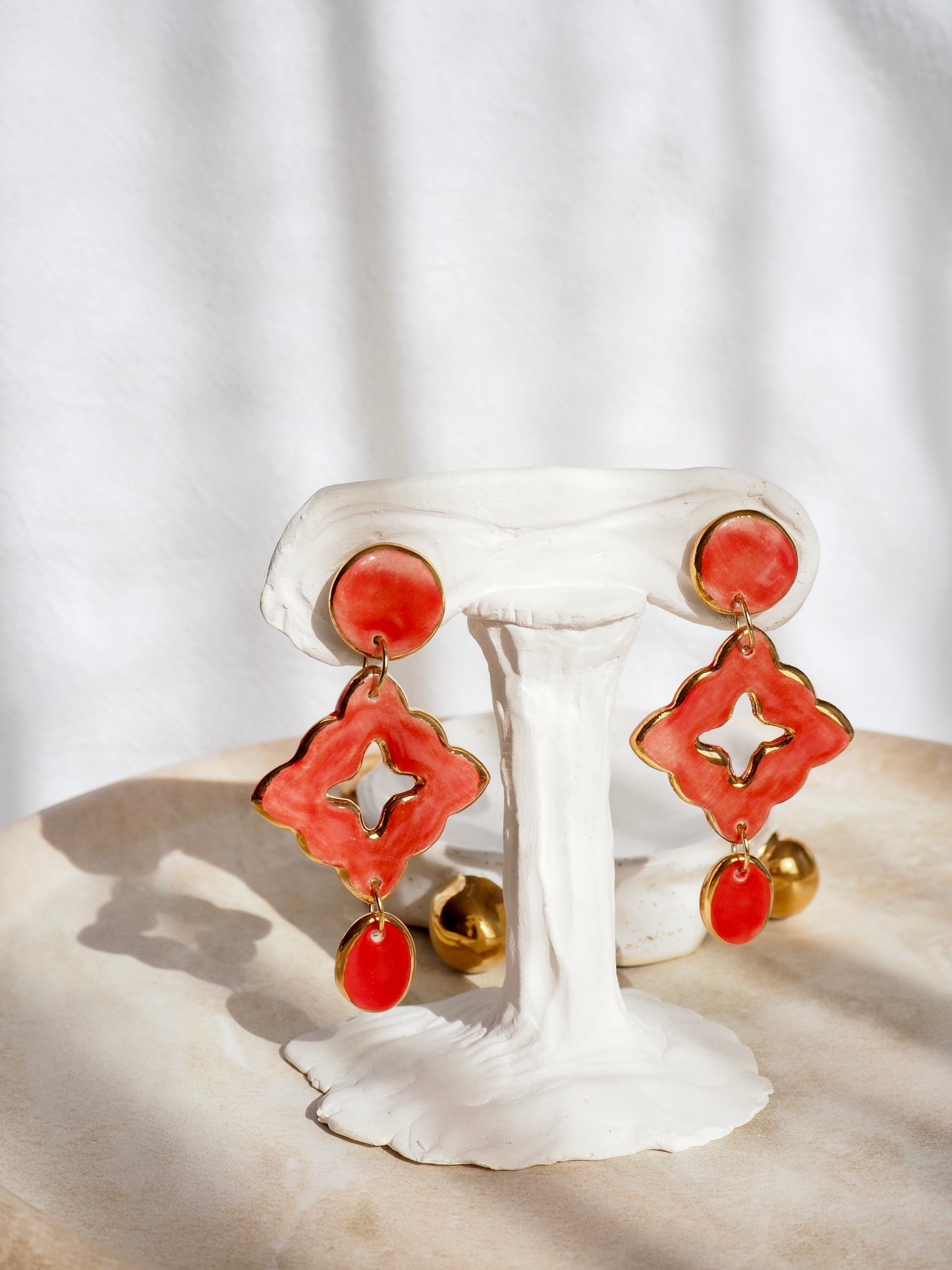“A Feast for your Eyes” Handmade Porcelain Earrings in Warm Red  coloured glaze with 24k gold lustre details.