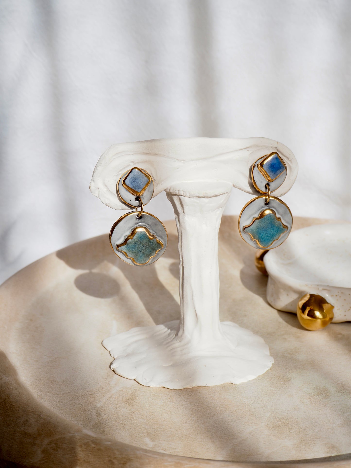 Pietra Collection handmade Black Clay Earrings coloured using green and blue glazes with 24k gold lustre details