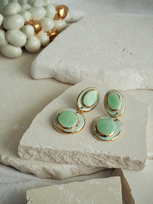 Femminilità Porcelain Earrings in Mint Green coloured glossy glaze on Parchment underglaze with 24k Gold lustre textured rims
