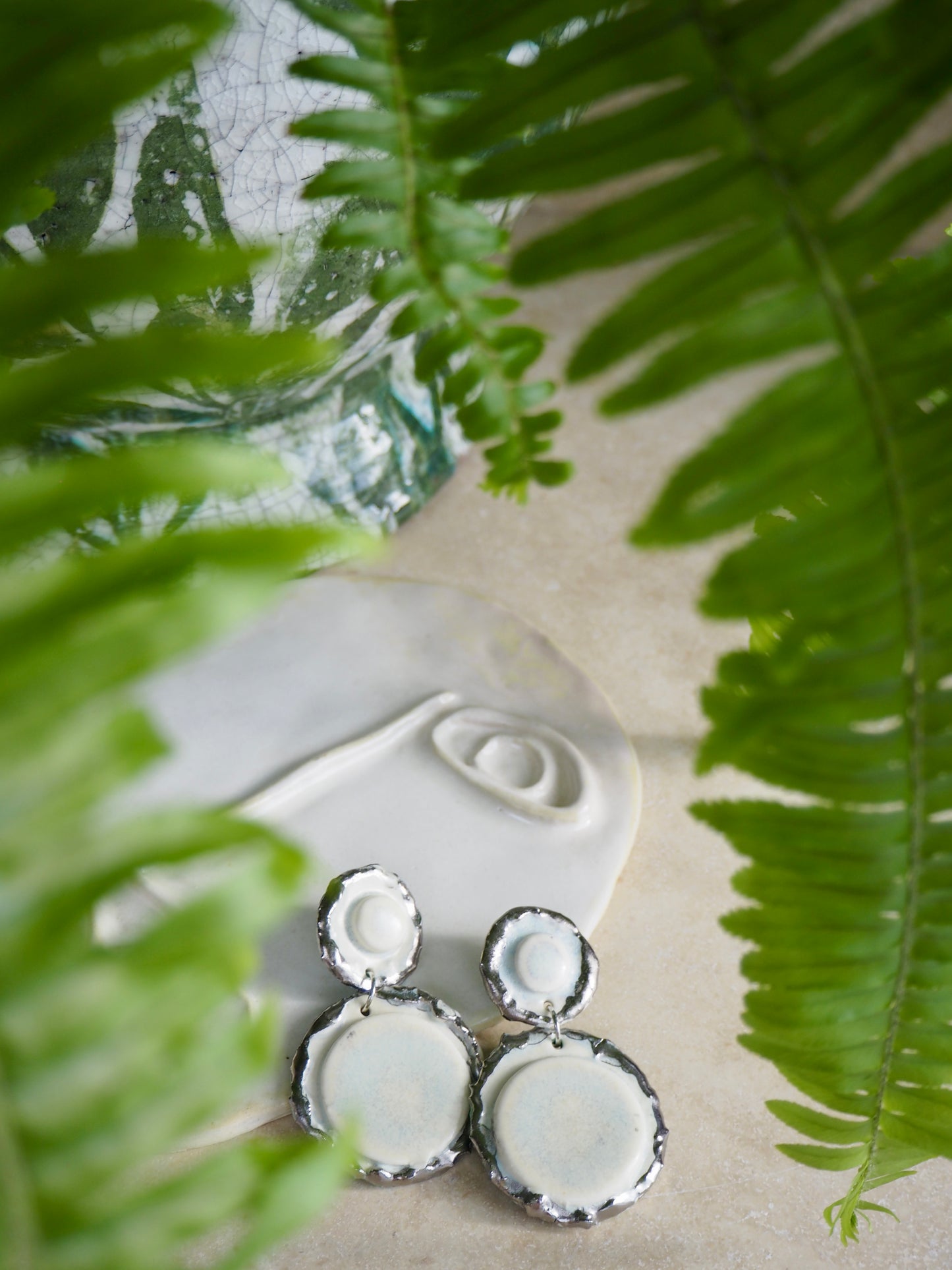Femminilità Porcelain Earrings in “Snow” coloured glaze with Platinum lustre textured rims in a matte finish