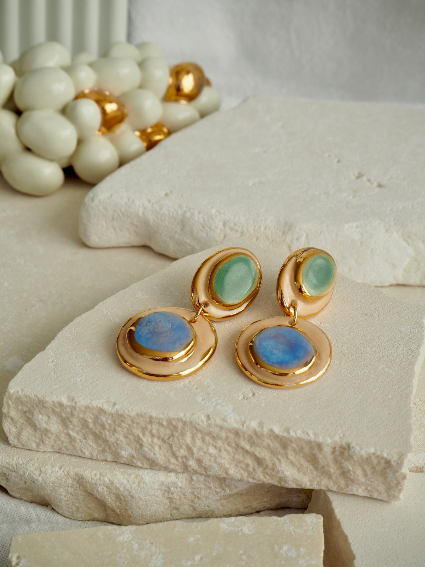 Femminilità Porcelain Earrings in Green and Blue coloured glossy glaze on Parchment underglaze with 24k Gold lustre textured rims